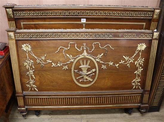 An Empire style parcel gilt bedstead, W.145cm